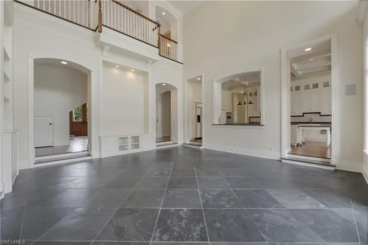 Main Floor Living Room with High Ceilings and Slate Flooring
