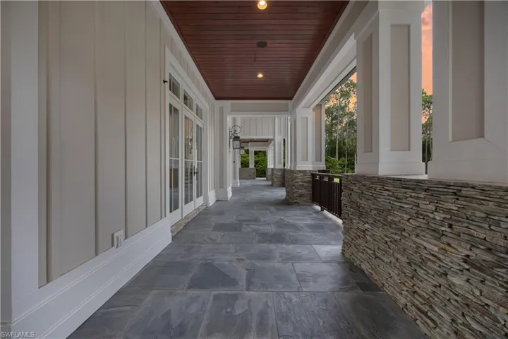 Slate Flooring Throughout Entertainment Areas and Expansive Pool Deck