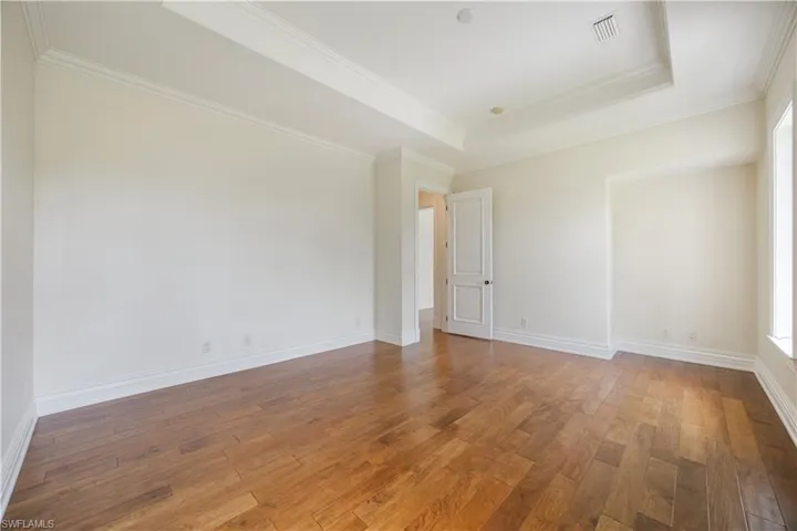 Spacious Bedroom with Hardwood Flooring