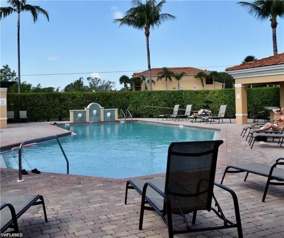 Community pool featuring a patio