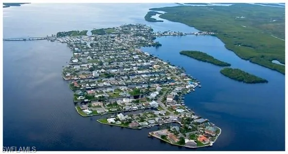 Aerial overview of property's location with a large body of water
