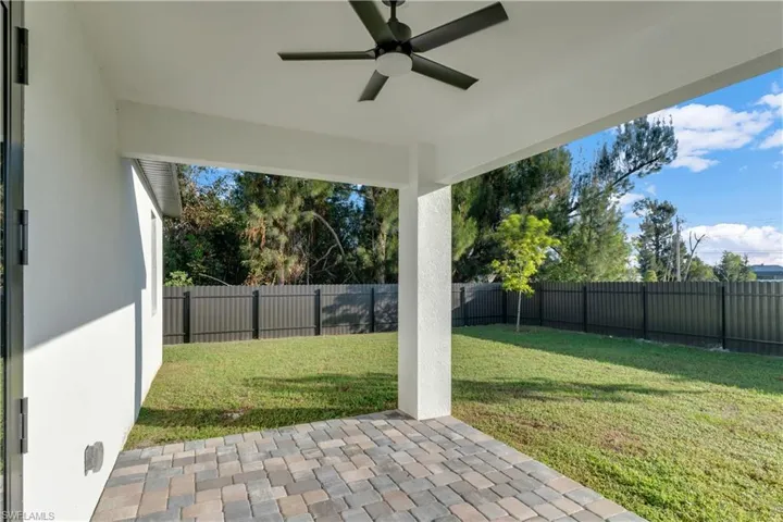 View of patio featuring ceiling fan