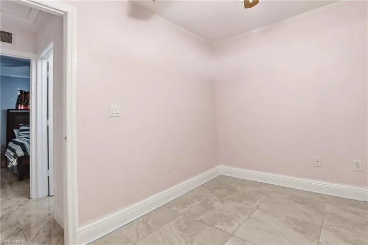 Spare room featuring baseboards