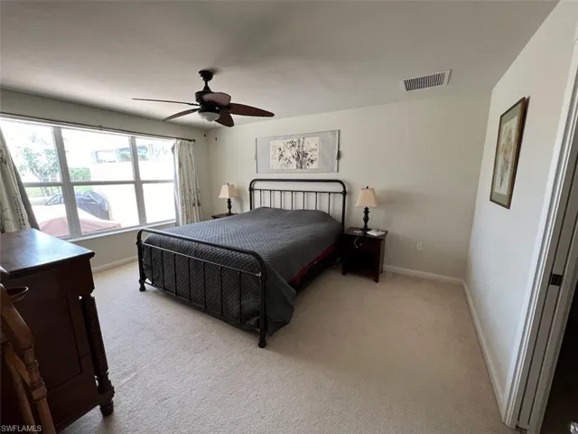Bedroom featuring carpet and ceiling fan