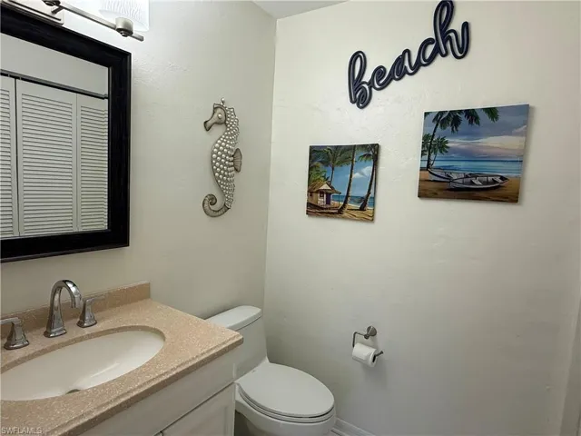 1/2 Bathroom with vanity and toilet