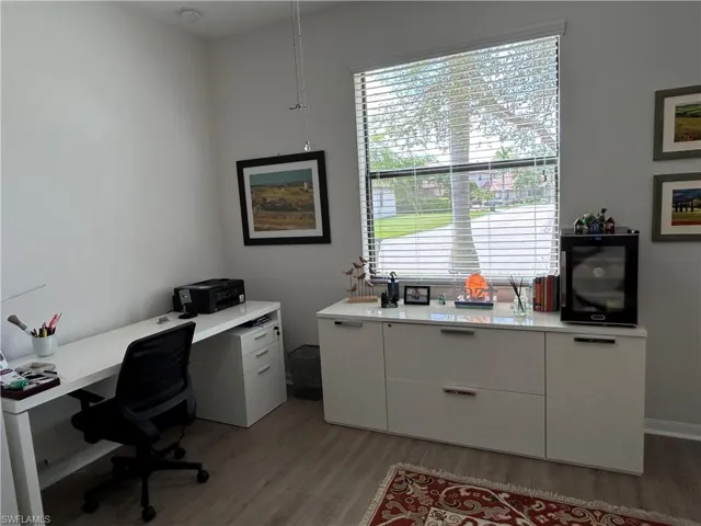 Office space with dark wood-style flooring