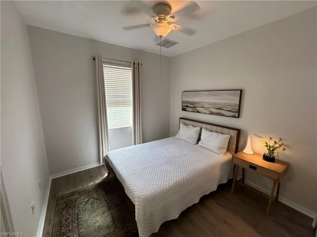 Bedroom with wood finished floors and a ceiling fan