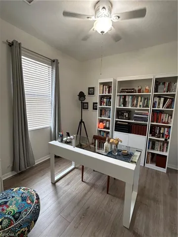 Office space featuring light wood finished floors and ceiling fan