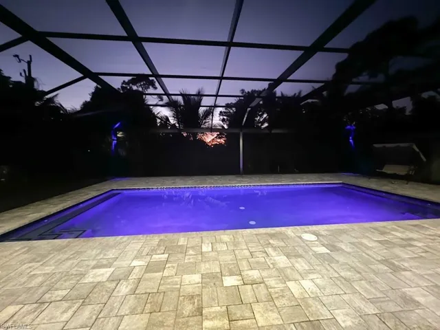 Swimming pool featuring glass enclosure