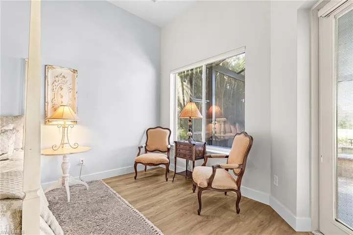 Primary Bedroom featuring light wood-style floors and baseboards