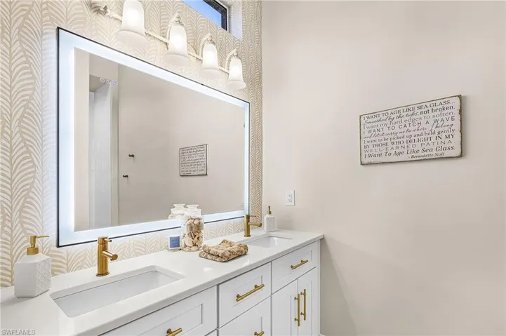 Bathroom featuring double vanity
