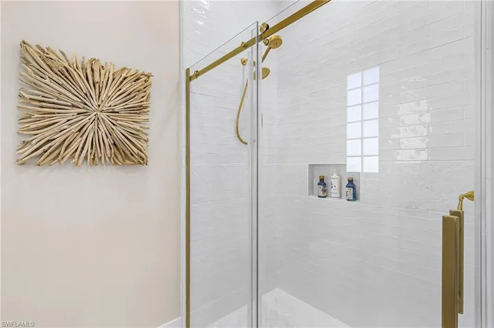 Full bathroom with a shower stall