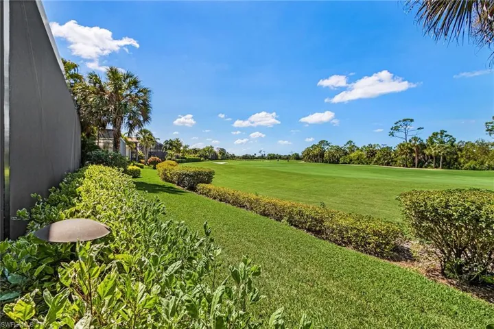 View of grassy yard featuring view of golf course