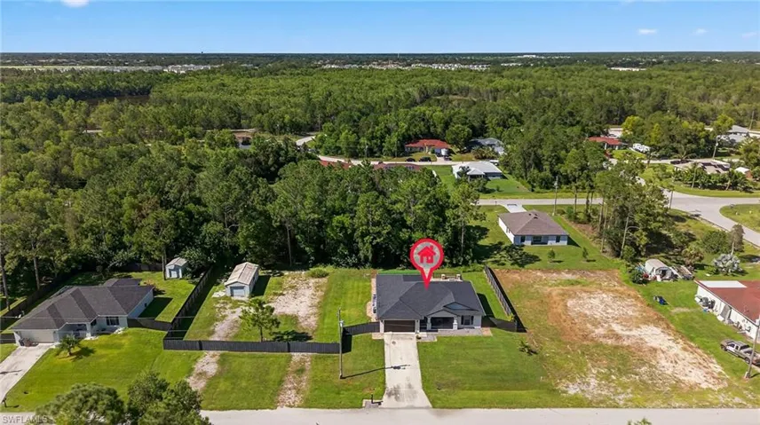 View of property location with nearby suburban area