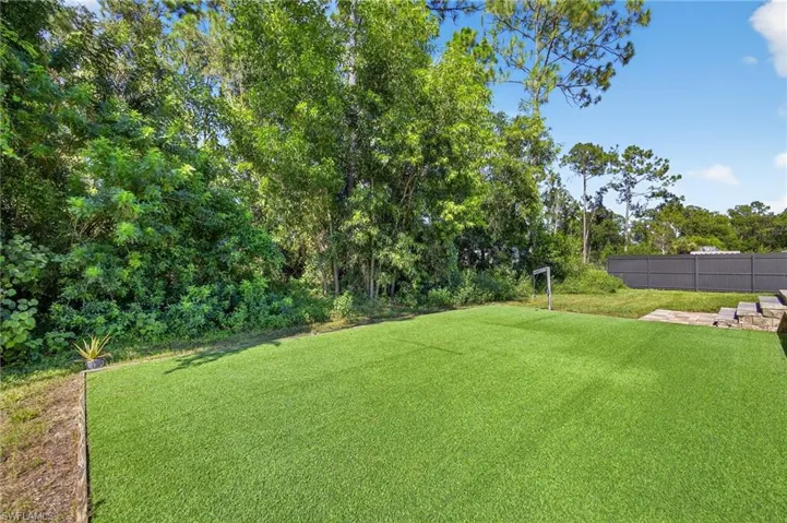 View of yard with view of scattered trees