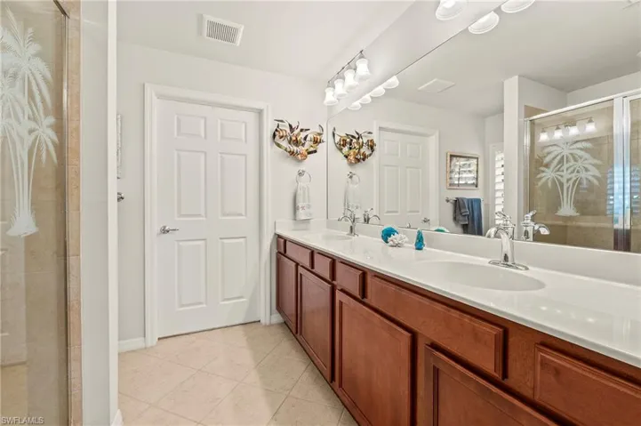 28528 Hammerhead Ln Bonita Springs 34135 - Owner's bath with walk in closet and window for additional light