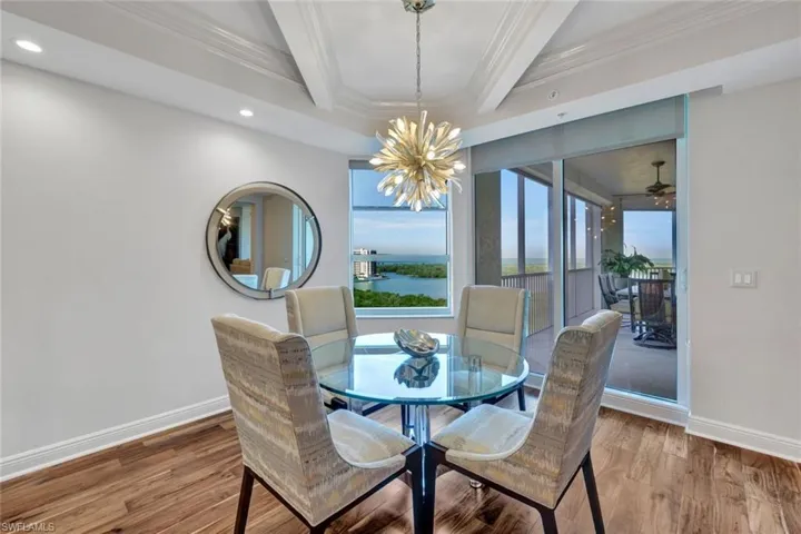 Dinette area in family room with open views onto lanai and Gulf.