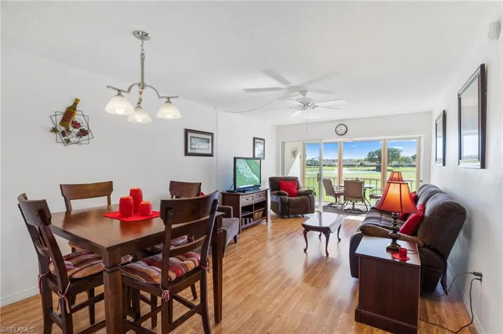 Dining room featuring  light wood-type flooring, and ceiling fan