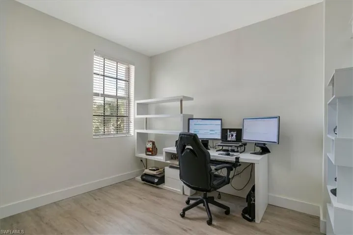 Office space with light wood-type flooring