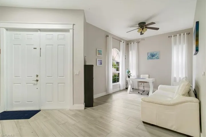 Entrance foyer featuring ceiling fan and light hardwood / wood-style flooring