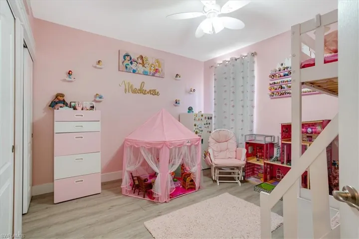 Bedroom featuring ceiling fan and light hardwood / wood-style flooring