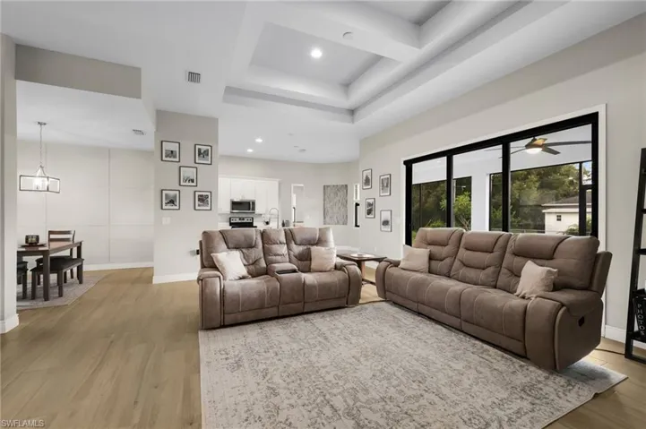 LIVING ROOM WITH TRIPLE SLIDER