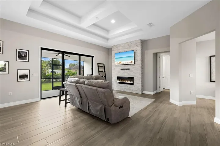 LIVING ROOM WITH COFFERED CEILING