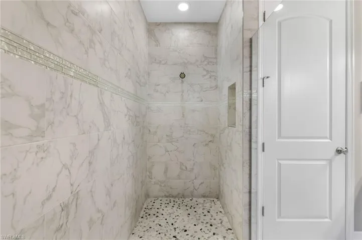 PRIMARY SHOWER WITH MULTIPLE SHOWER HEADS