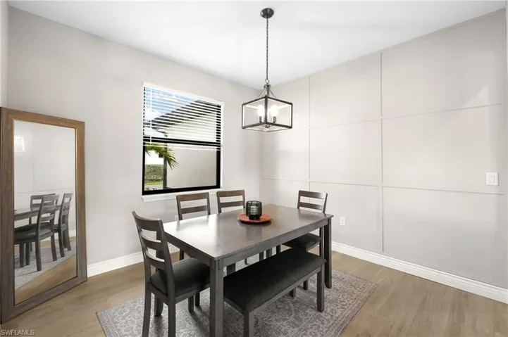 DINING AREA WITH FRAMED ACCENT WALL