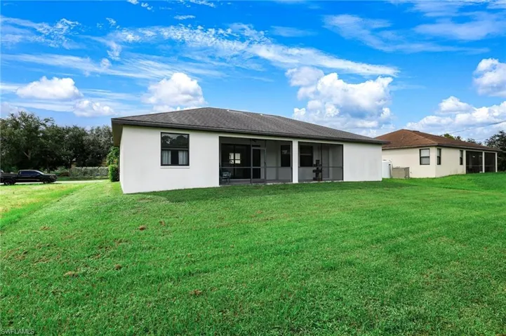REAR ELEVATION WITH PLENTY OF YARD FOR A POOL