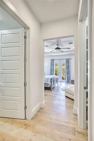 Hall featuring light wood-style flooring and french doors