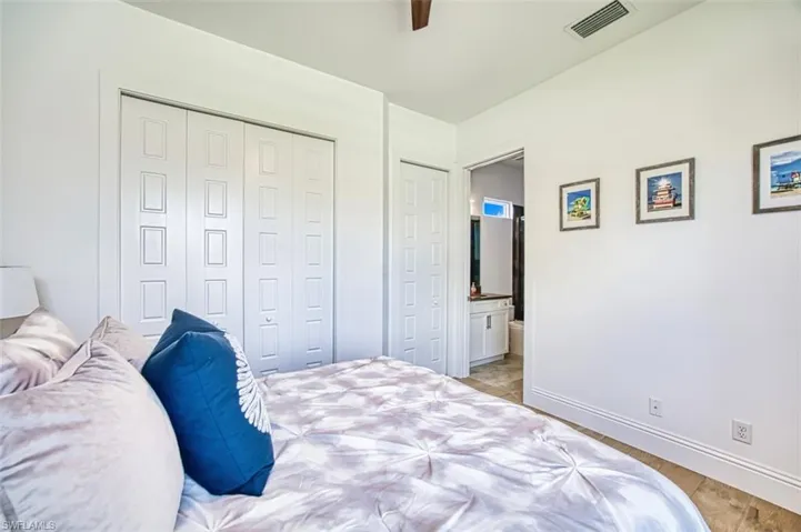 Bedroom featuring light wood finished floors, a closet, and a ceiling fan
