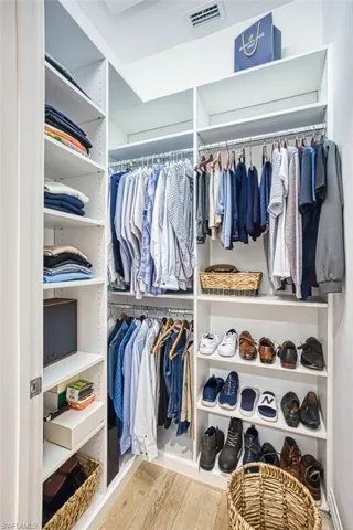 Spacious closet featuring wood finished floors
