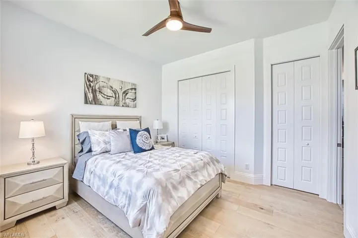 Bedroom featuring light wood-style floors and ceiling fan