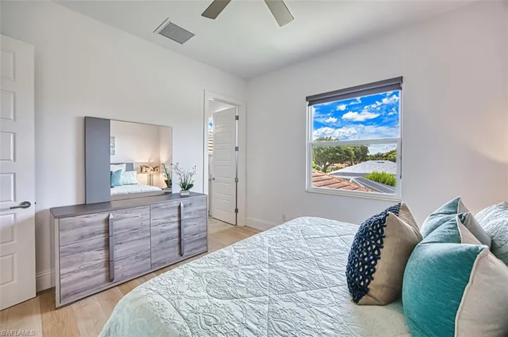 Bedroom featuring light wood-type flooring and ceiling fan