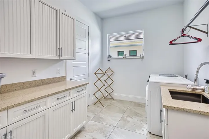 Laundry room with cabinet space and separate washer and dryer