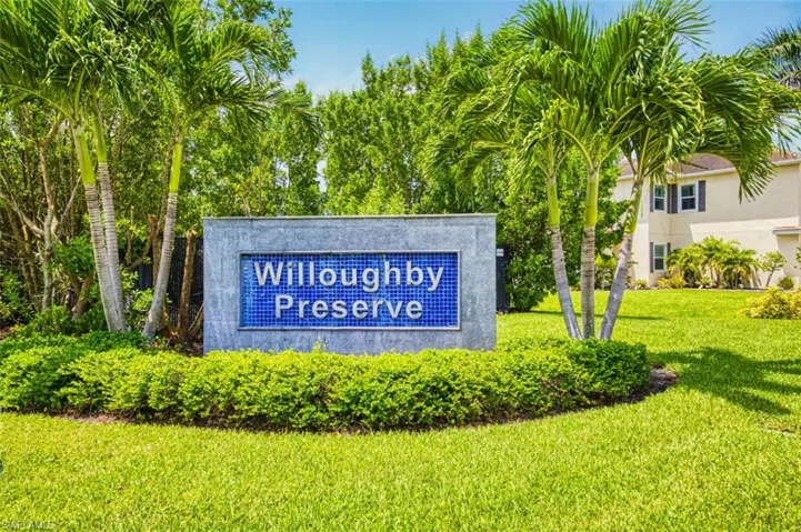 Community sign featuring a lawn