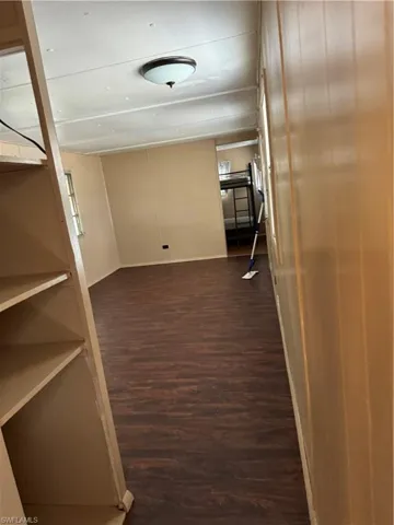 Hall featuring dark hardwood / wood-style flooring