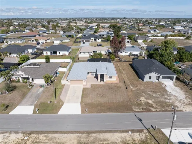 View of property location with nearby suburban area