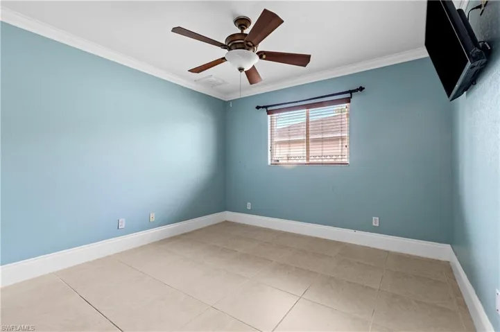 Bedroom 3  room featuring crown molding, ceiling fan, and tile patterned floors