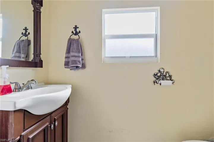 Pool Bathroom featuring vanity and Toilet