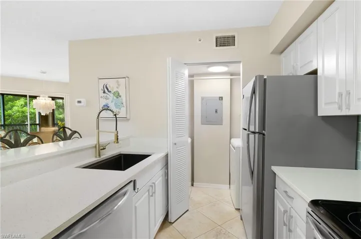 Closet to Laundry Area with Washer and Dryer, Shelving for Storage