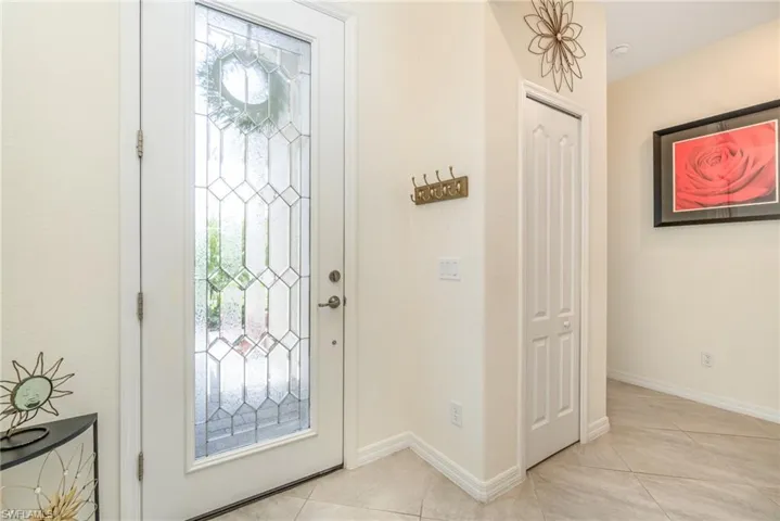 Tiled entryway with a wealth of natural light
