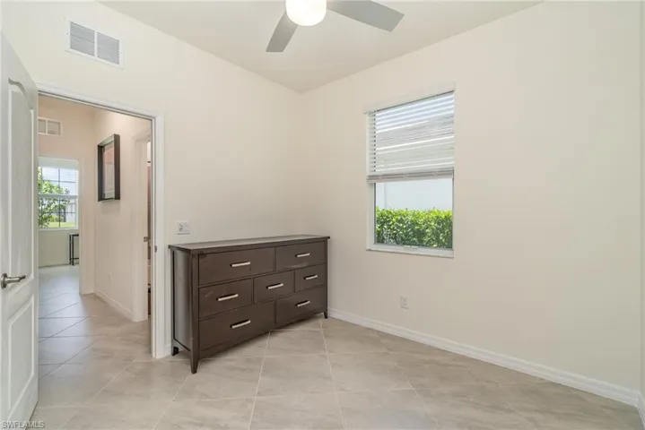 Bedroom featuring ceiling fan and light tile patterned floors