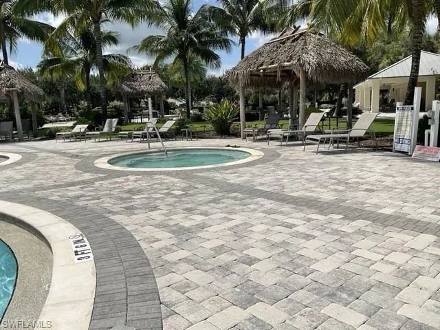 View of pool with a patio and a gazebo