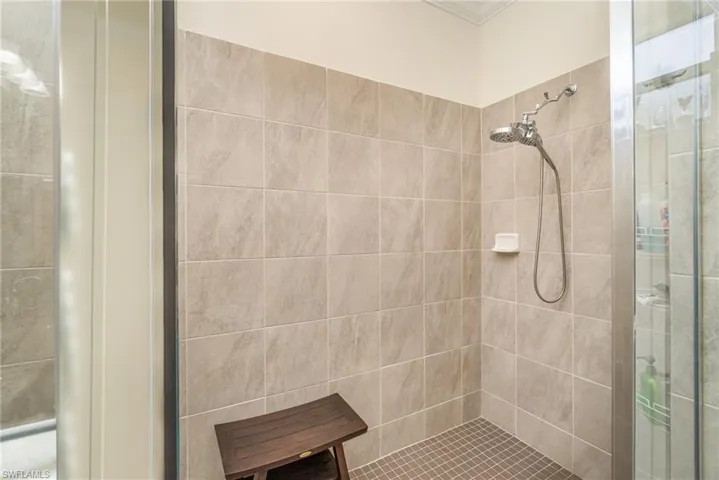 Bathroom featuring a tile shower