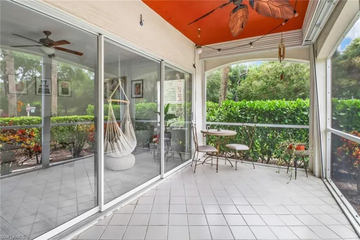 Unfurnished sunroom featuring ceiling fan