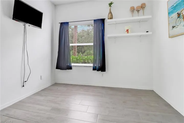 Spare room with a healthy amount of sunlight and light wood-type flooring