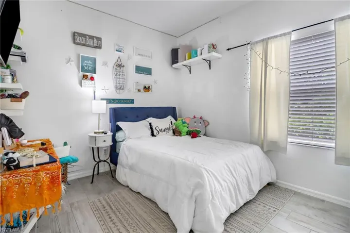 Bedroom with light hardwood / wood-style floors