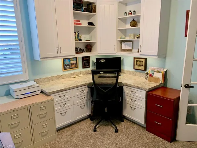Office with built in desk when It was furnished.